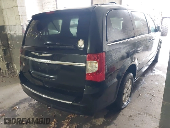 2011 Chrysler Town & Country Touring with VIN 2A4RR5DGXBR745293, listed as a IAAI auction lot 41862089 with 999,999 mi miles. Bid and sale history available at carsss.com. Image 4.