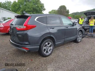 2018 Honda CR-V EX z VIN 7FARW2H50JE094132, wystawiony jako IAAI lot #42337889 z przebiegiem 59 273 mil mil oraz . Historia ofert i sprzedaży dostępna na DreamBid. Obrazek 4.
