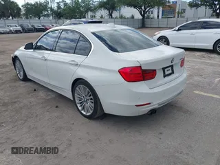 2012 BMW 3 Series 328i with VIN WBA3A5C57CF347953, listed as a IAAI auction lot 42176008 with 140,598 mi miles and . Bid and sale history available at carsss.com. Image 3.