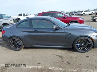 2018 BMW M2 with VIN WBS1J5C50JVE51869, listed as a IAAI auction lot 41814404 with 69,684 mi miles. Bid and sale history available at carsss.com. Image 13.