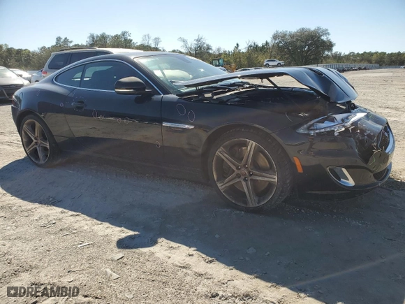 2015 Jaguar XK with VIN SAJWA4DCXFMB55227, listed as a Copart auction lot 48455465 with 64,050 mi miles and Salvage Title. Bid and sale history available at carsss.com. Image 4.