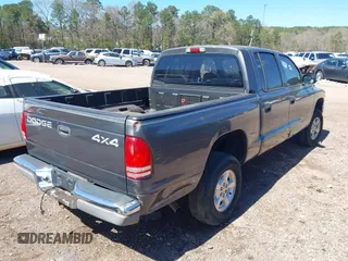 2002 Dodge Dakota SLT z VIN 1B7HG48NX2S623588, wystawiony jako IAAI lot #41793068 z przebiegiem 213 159 mil mil oraz . Historia ofert i sprzedaży dostępna na DreamBid. Obrazek 4.