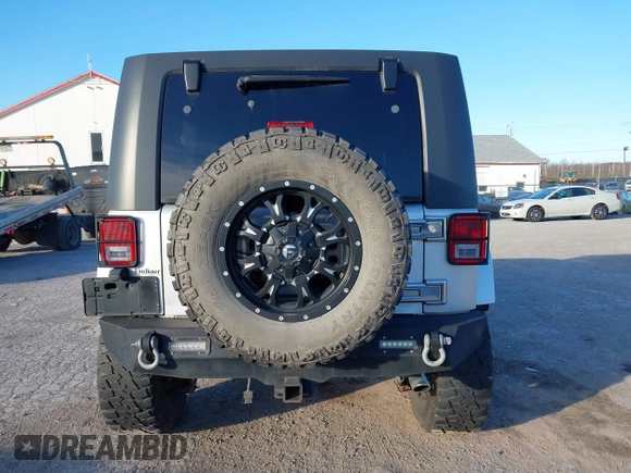 2010 Jeep Wrangler Unlimited Sahara with VIN 1J4BA5H14AL230604, listed as a IAAI auction lot 41884346 with 97,060 mi miles. Bid and sale history available at carsss.com. Image 16.