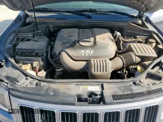 2014 Jeep Grand Cherokee Laredo with VIN 1C4RJEAG4EC182773, listed as a Copart auction lot 54085255 with 138,775 mi miles and Salvage Title. Bid and sale history available at DreamBid. Image 12.