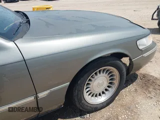 2002 Mercury Grand Marquis LS Premium z VIN 2MEFM75W22X617584, wystawiony jako IAAI lot #42444579 z przebiegiem 199 914 mil mil oraz . Historia ofert i sprzedaży dostępna na DreamBid. Obrazek 6.
