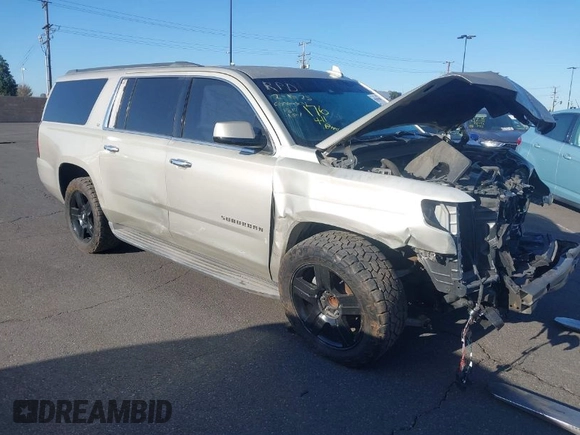 2015 Chevrolet Suburban LT z VIN 1GNSCJKC1FR608117, wystawiony jako IAAI lot #41641560 z przebiegiem 163 770 mil mil oraz . Historia ofert i sprzedaży dostępna na DreamBid. Obrazek 1.