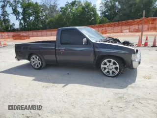 1996 Nissan Frontier XE z VIN 1N6SD11S0TC311270, wystawiony jako Copart lot #53870965 z przebiegiem 145 595 mil mil oraz Szkoda całkowita • Salvage title. Historia ofert i sprzedaży dostępna na DreamBid. Obrazek 4.