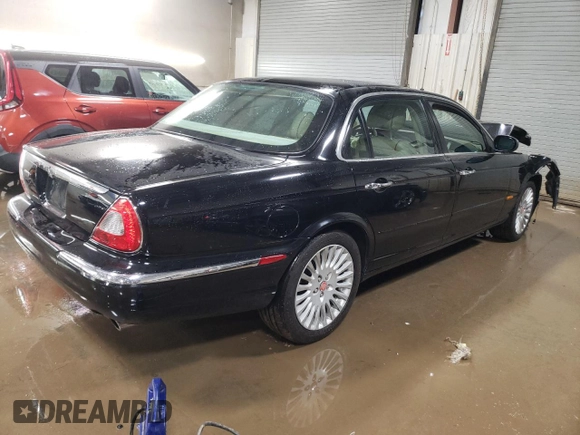 2005 Jaguar XJ Vanden Plas z VIN SAJWA82C65SG44373, wystawiony jako Copart lot #84091444 z przebiegiem 141 993 mil mil oraz Szkoda całkowita • Salvage title. Historia ofert i sprzedaży dostępna na DreamBid. Obrazek 3.