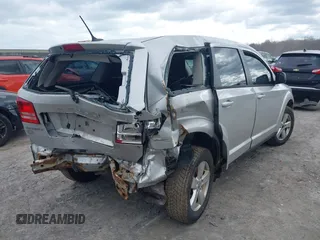 2013 Dodge Journey SE with VIN 3C4PDCAB9DT532554, listed as a IAAI auction lot 42026129 with 164,599 mi miles. Bid and sale history available at carsss.com. Image 4.