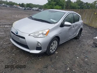 2014 Toyota Prius One z VIN JTDKDTB36E1063708, wystawiony jako IAAI lot #42267146 z przebiegiem 71 871 mil mil oraz . Historia ofert i sprzedaży dostępna na DreamBid. Obrazek 2.
