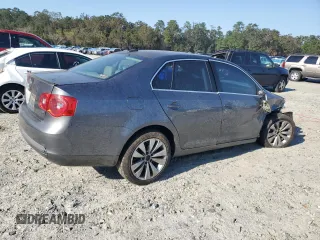 2006 Volkswagen Jetta z VIN 3VWDG71K26M673879, wystawiony jako Copart lot #75674634 z przebiegiem 93 689 mil mil oraz Szkoda całkowita • Salvage title. Historia ofert i sprzedaży dostępna na DreamBid. Obrazek 3.