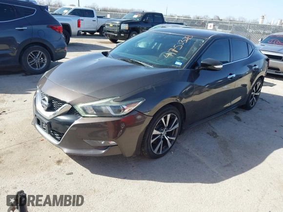 2016 Nissan Maxima Platinum with VIN 1N4AA6AP2GC385723, listed as a IAAI auction lot 41753328 with 162,845 mi miles and . Bid and sale history available at DreamBid. Image 2.