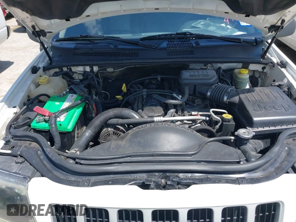 2004 Jeep Grand Cherokee Laredo z VIN 1J4GX48S74C152542, wystawiony jako IAAI lot #42350507 z przebiegiem 176 366 mil mil oraz . Historia ofert i sprzedaży dostępna na DreamBid. Obrazek 10.