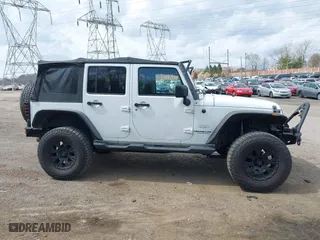 2012 Jeep Wrangler Unlimited Sahara with VIN 1C4BJWEG9CL220965, listed as a IAAI auction lot 41902295 with 120,492 mi miles. Bid and sale history available at carsss.com. Image 14.