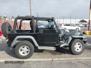 2003 Jeep Wrangler Sport with VIN 1J4FA49S23P328867, listed as a IAAI auction lot 41354414 with 96,703 mi miles. Bid and sale history available at carsss.com. Image 13.