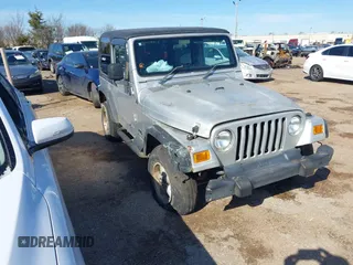 2004 Jeep Wrangler Sport Right Hand Drive with VIN 1J4F449SX4P780560, listed as a IAAI auction lot 41645721 with 146,681 mi miles. Bid and sale history available at carsss.com. Image 1.