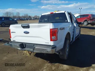 2015 Ford F-150 XLT with VIN 1FTEW1EF8FKE35305, listed as a IAAI auction lot 41679383 with 153,901 mi miles. Bid and sale history available at carsss.com. Image 4.
