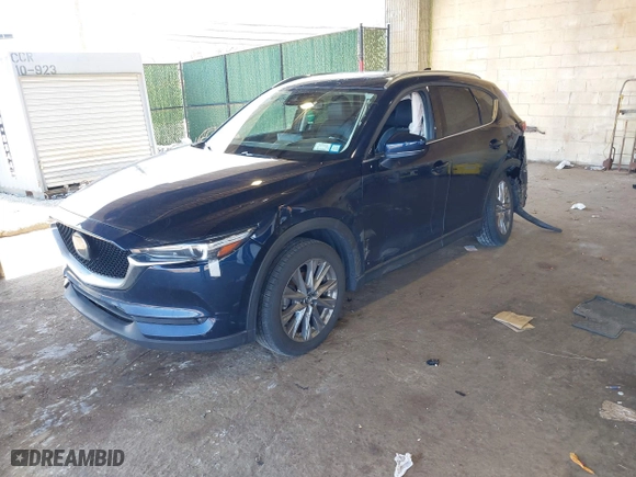 2021 Mazda CX-5 Grand Touring Reserve with VIN JM3KFBAY7M0466156, listed as a IAAI auction lot 41931407 with 55,136 mi miles. Bid and sale history available at carsss.com. Image 17.