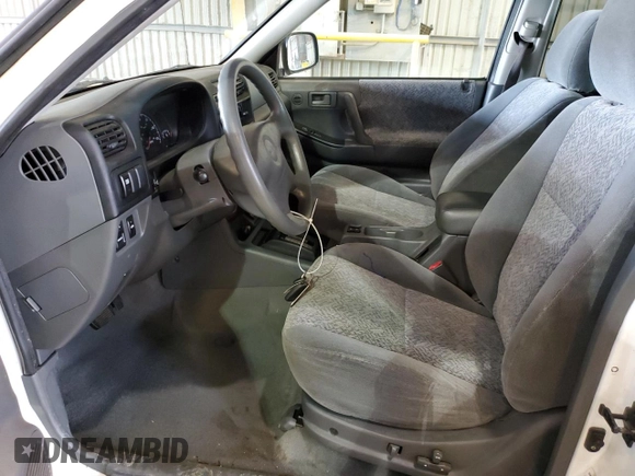 2002 Isuzu Rodeo S with VIN 4S2CK58W724316668, listed as a Copart auction lot 72154754 with 141,590 mi miles and Salvage Title. Bid and sale history available at DreamBid. Image 7.