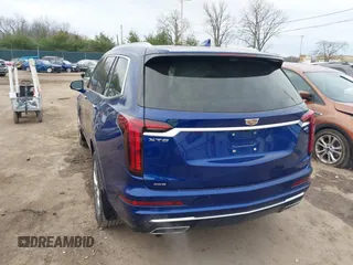 2023 Cadillac XT6 AWD Premium Luxury with VIN 1GYKPDRS2PZ126666, listed as a IAAI auction lot 40963833 with 23,535 mi miles and . Bid and sale history available at DreamBid. Image 3.