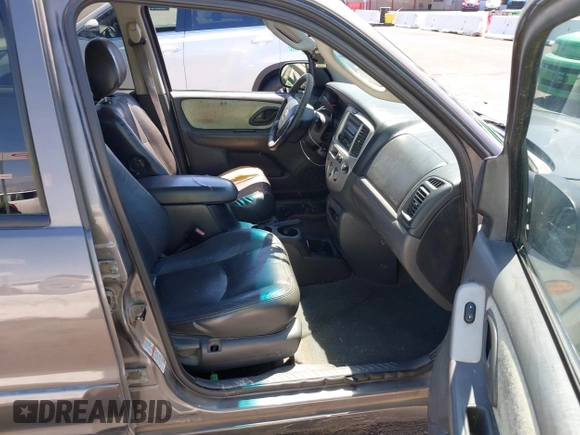 2003 Mazda Tribute ES with VIN 4F2CZ96113KM52877, listed as a IAAI auction lot 42217251 with 218,475 mi miles and . Bid and sale history available at DreamBid. Image 5.