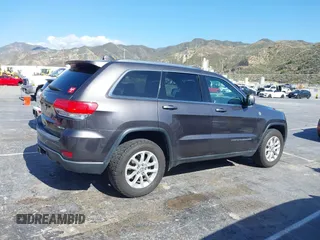 2016 Jeep Grand Cherokee Laredo z VIN 1C4RJFAG5GC390413, wystawiony jako IAAI lot #42254165 z przebiegiem 99 231 mil mil oraz . Historia ofert i sprzedaży dostępna na DreamBid. Obrazek 13.