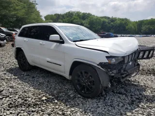 2018 Jeep Grand Cherokee Altitude with VIN 1C4RJFAGXJC122688, listed as a Copart auction lot 61290525 with 106,671 mi miles and Salvage title. Bid and sale history available at DreamBid. Image 4.