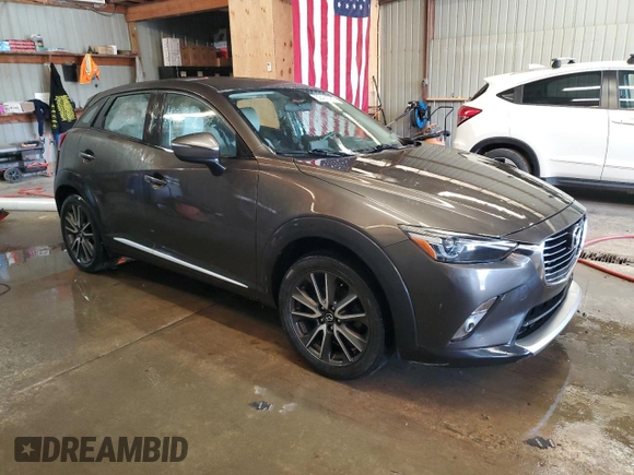 2016 Mazda CX-3 Grand Touring z VIN JM1DKFD74G0137815, wystawiony jako Copart lot #52405765 z przebiegiem 128 922 mil mil oraz Szkoda całkowita • Salvage title. Historia ofert i sprzedaży dostępna na DreamBid. Obrazek 4.