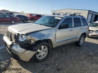 2010 Jeep Grand Cherokee Laredo with VIN 1J4RR4GT1AC106990, listed as a Copart auction lot 87421664 with 106,025 mi miles and Salvage Title. Bid and sale history available at carsss.com. Image 1.