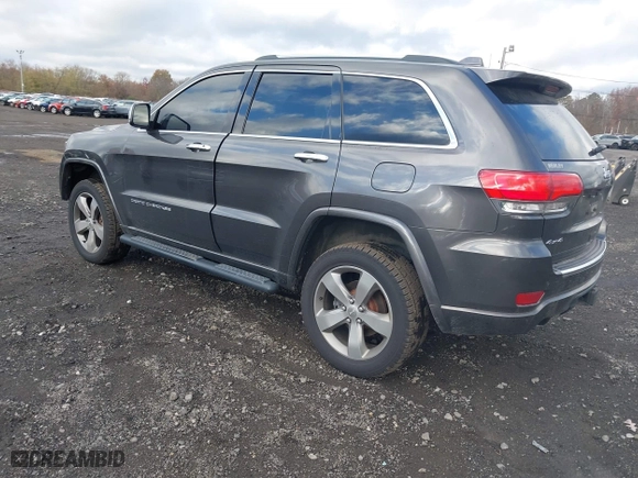 2014 Jeep Grand Cherokee Overland with VIN 1C4RJFCG5EC329377, listed as a IAAI auction lot 40822324 with 106,222 mi miles. Bid and sale history available at carsss.com. Image 3.