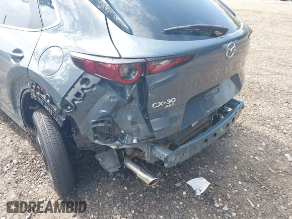 2023 Mazda CX-30 S Preferred z VIN 3MVDMBCM4PM558181, wystawiony jako IAAI lot #42589333 z przebiegiem 12 384 mil mil oraz . Historia ofert i sprzedaży dostępna na DreamBid. Obrazek 6.
