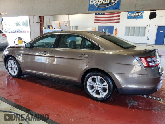 2015 Ford Taurus SEL with VIN 1FAHP2E94FG157022, listed as a Copart auction lot 74569614 with 133,223 mi miles and Salvage Title. Bid and sale history available at DreamBid. Image 2.