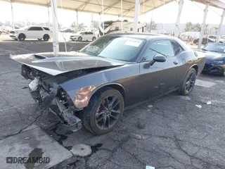 2021 Dodge Challenger GT with VIN 2C3CDZKG4MH677574, listed as a IAAI auction lot 41460036 with 67,170 mi miles. Bid and sale history available at carsss.com. Image 2.