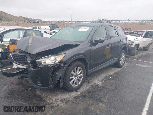 2016 Mazda CX-5 Touring with VIN JM3KE2CY7G0630056, listed as a IAAI auction lot 41817525 with 97,844 mi miles and . Bid and sale history available at DreamBid. Image 17.