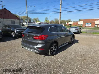 2017 BMW X1 xDrive28i with VIN WBXHT3C32H5F79305, listed as a Copart auction lot 54665865 with 113,046 mi miles and Clean Title. Bid and sale history available at carsss.com. Image 4.