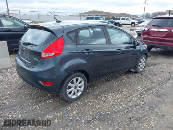 2011 Ford Fiesta SE with VIN 3FADP4EJ4BM228417, listed as a IAAI auction lot 42061494 with 86,873 mi miles. Bid and sale history available at carsss.com. Image 4.