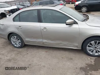 2015 Volkswagen Jetta Sedan 1.8T SE w/Connectivity with VIN 3VWD07AJ9FM326125, listed as a IAAI auction lot 41531163 with 141,284 mi miles. Bid and sale history available at carsss.com. Image 13.