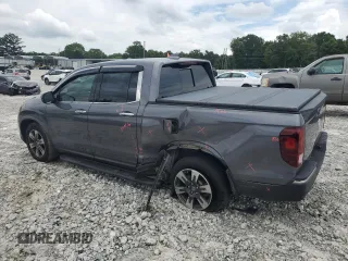 2019 Honda Ridgeline RTL-E with VIN 5FPYK3F77KB005131, listed as a Copart auction lot 60726155 with 81,797 mi miles and Salvage title. Bid and sale history available at DreamBid. Image 2.