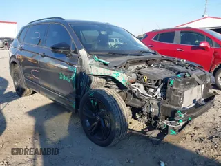 2023 Volkswagen Tiguan SE R-Line Black with VIN 3VV8B7AX3PM014632, listed as a IAAI auction lot 41002858 with 40,955 mi miles and . Bid and sale history available at DreamBid. Image 1.