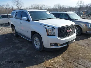 2016 GMC Yukon SLT with VIN 1GKS2BKCXGR285421, listed as a IAAI auction lot 41533020 with 126,962 mi miles. Bid and sale history available at carsss.com. Image 1.