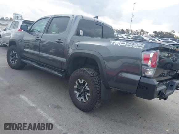 2021 Toyota Tacoma SR z VIN 3TMCZ5AN9MM397611, wystawiony jako IAAI lot #41467705 z przebiegiem 65 191 mil mil oraz . Historia ofert i sprzedaży dostępna na DreamBid. Obrazek 3.