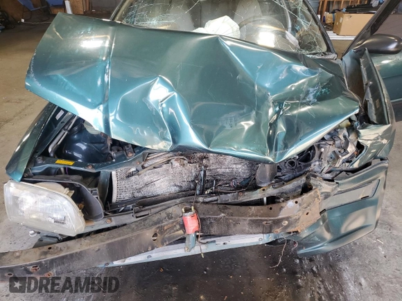1996 Toyota Tercel DX z VIN JT2BC52L7T7044201, wystawiony jako Copart lot #77190074 z przebiegiem Nie podano mil oraz Szkoda całkowita • Salvage title. Historia ofert i sprzedaży dostępna na DreamBid. Obrazek 13.