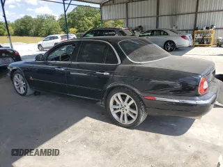 2004 Jaguar XJ с VIN SAJEA73B24TG10774, выставлен на аукционе Copart как лот 72577604 с пробегом 217 846 миль миль и Чистый • Clean title. История ставок и продаж доступна на DreamBid. Изображение 2.