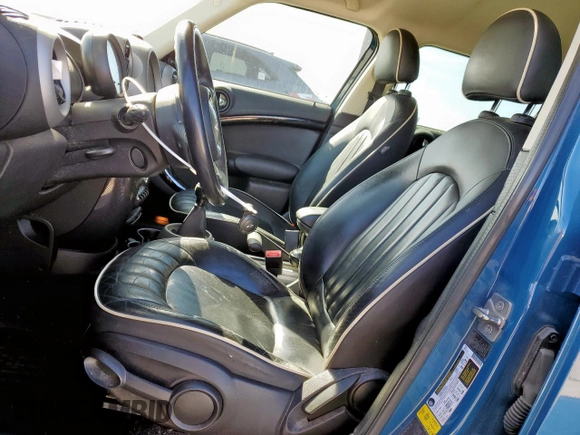 2012 MINI Countryman S with VIN WMWZC3C5XCWM27675, listed as a Copart auction lot 49676205 with 111,499 mi miles and Salvage title. Bid and sale history available at DreamBid. Image 7.