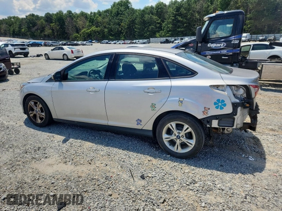 2013 Ford Focus SE with VIN 1FADP3F22DL323418, listed as a Copart auction lot 61859225 with 62,415 mi miles and Salvage title. Bid and sale history available at DreamBid. Image 2.