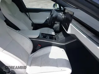 2022 Tesla Model S Plaid with VIN 5YJSA1E61NF460155, listed as a IAAI auction lot 42545167 with 51,711 mi miles and . Bid and sale history available at DreamBid. Image 5.
