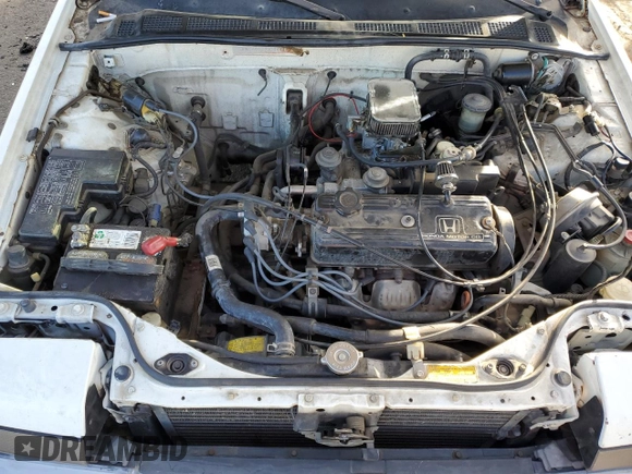 1987 Honda Accord z VIN JHMCA5633HC044303, wystawiony jako Copart lot #85697384 z przebiegiem 19 871 mil mil oraz Nie do naprawy • Non repairable. Historia ofert i sprzedaży dostępna na DreamBid. Obrazek 11.