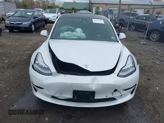 2019 Tesla Model 3 Mid Range with VIN 5YJ3E1EA5KF397098, listed as a IAAI auction lot 41943570 with 72,046 mi miles and . Bid and sale history available at DreamBid. Image 6.