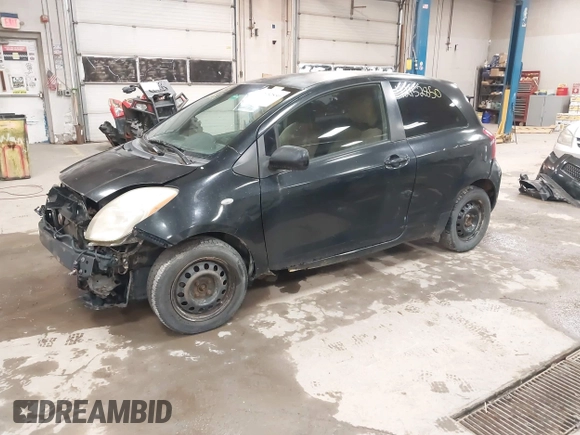2008 Toyota Yaris with VIN JTDJT923285196299, listed as a IAAI auction lot 42152850 with 214,238 mi miles. Bid and sale history available at carsss.com. Image 2.