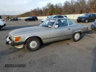 1987 Mercedes-Benz 560 560SL with VIN WDBBA48D9HA070265, listed as a Copart auction lot 77411844 with 120,884 mi miles and Salvage Title. Bid and sale history available at carsss.com. Image 1.